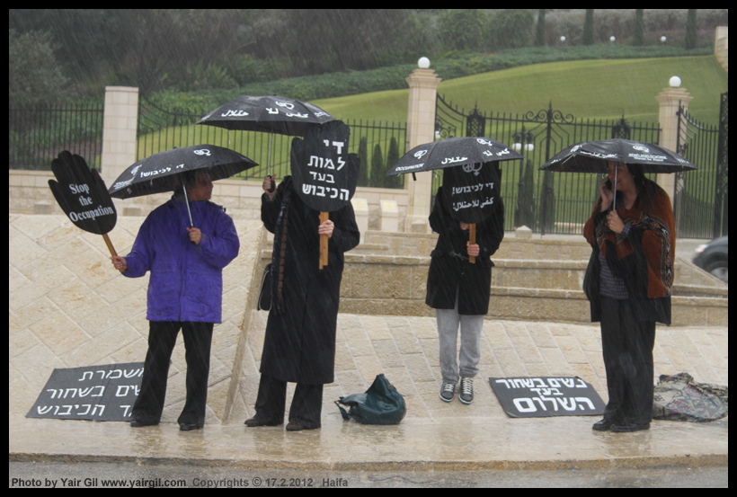 Four Women in Black in Pouring Rain; Haifa 17/2/2012 - צילום חברתי